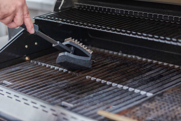 Cleaning outdoor gas grill before next grilling.